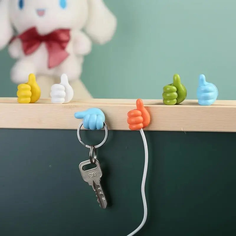 Set de 4 Ganchos de Pared en Forma de Pulgar - Organizador de Cables Adhesivo Decorativo para Escritorio y Habitación, Sujeta Cables Multiusos de Silicona