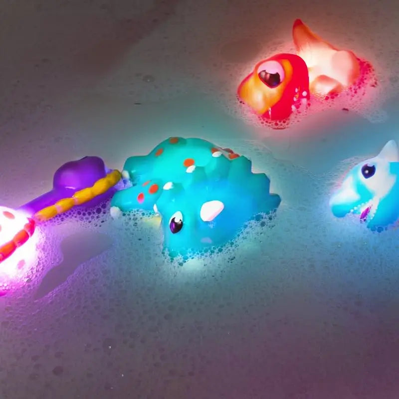 Juguetes de Baño de Dinosaurios con Luz, Paquete de 6 | Juguetes Activados por Agua que Cambian de Color | Juguetes Blandos y Exprimibles para Bebés y Niños | Luces Sensoriales para Tina Libres de Moho