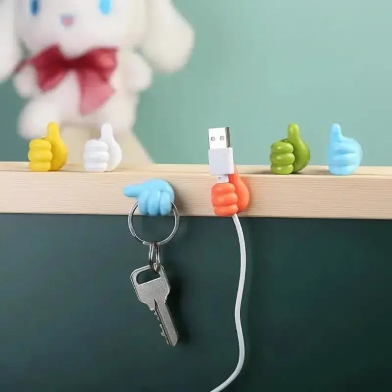 Set de 4 Ganchos de Pared en Forma de Pulgar - Organizador de Cables Adhesivo Decorativo para Escritorio y Habitación, Sujeta Cables Multiusos de Silicona